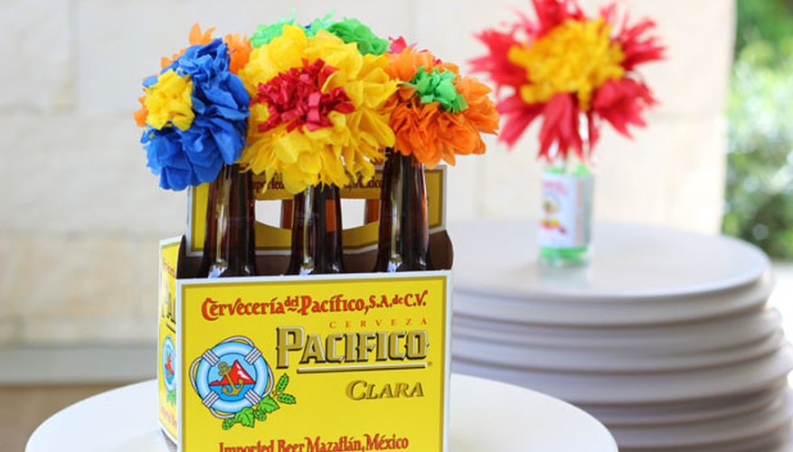 Photo Credit: Jonathan Fong Arrange flowers in beer bottles
