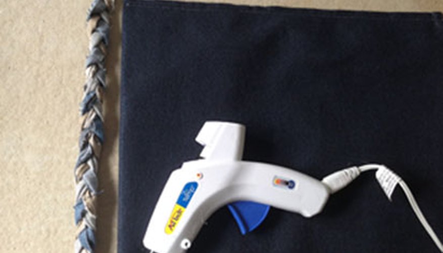 Make a zigzag with the glue gun to secure braid. Make a zigzag with the glue gun to secure braid.