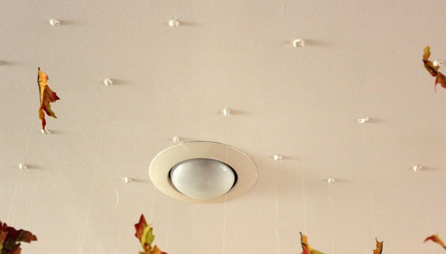 Press the poster putty to the ceiling Press the poster putty to the ceiling