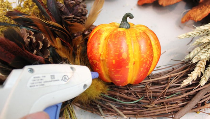 Photo Credit: Jonathan Fong Hot glue gourds to the wreath