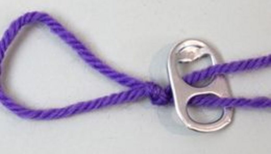 Photo Credit: Jonathan Fong Thread string through the first tab