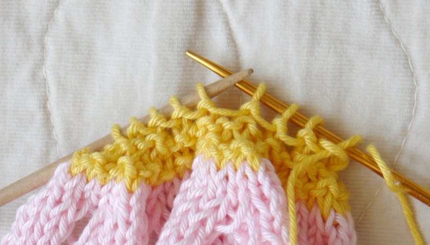 Place the stitches onto the yarn needle. Place the stitches onto the yarn needle.