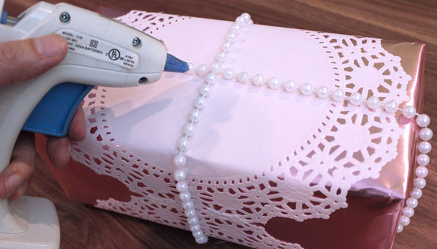 Photo Credit: Jonathan Fong Wrap plastic pearls around the gift