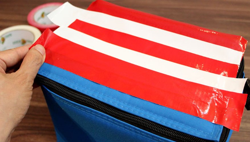 Layer red and white duck tape to make stripes Layer red and white duck tape to make stripes