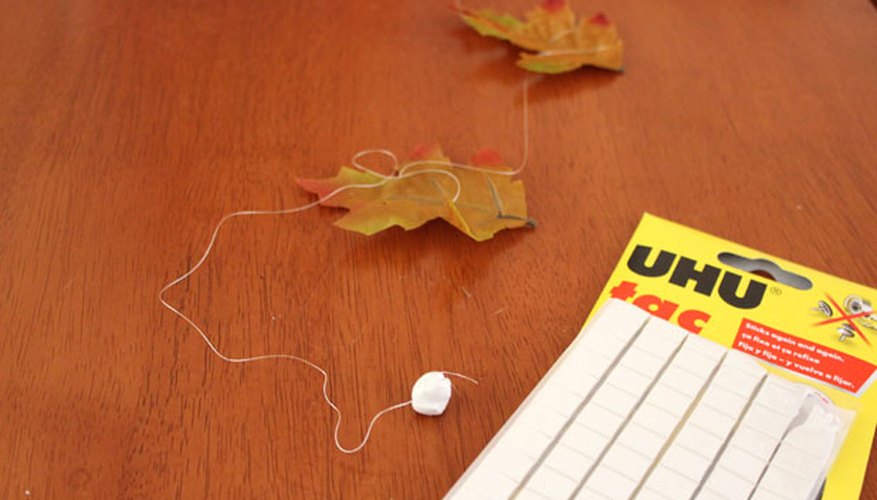 Attach poster putty to the end of the thread Attach poster putty to the end of the thread