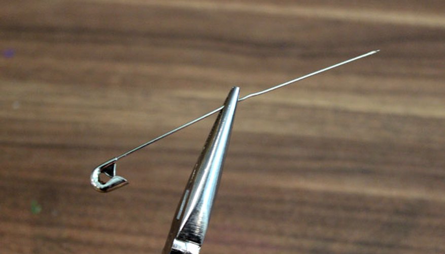 Straighten a safety pin Straighten a safety pin