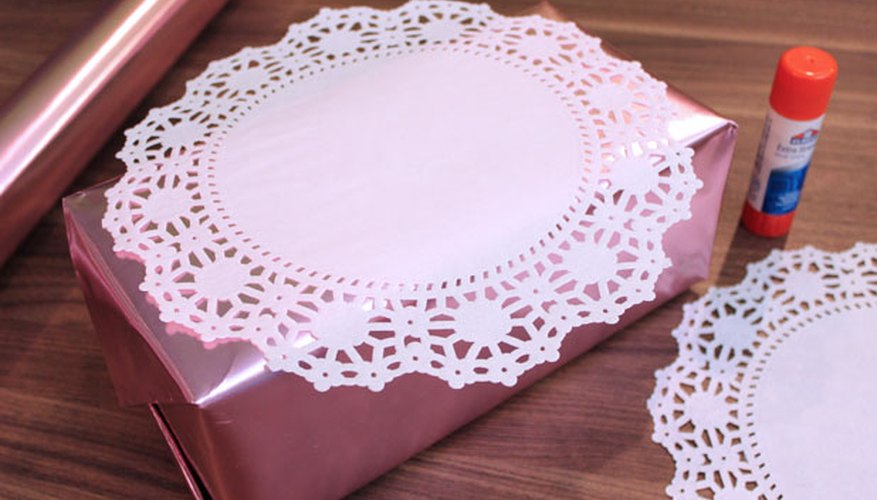Photo Credit: Jonathan Fong Adhere paper doilies to box