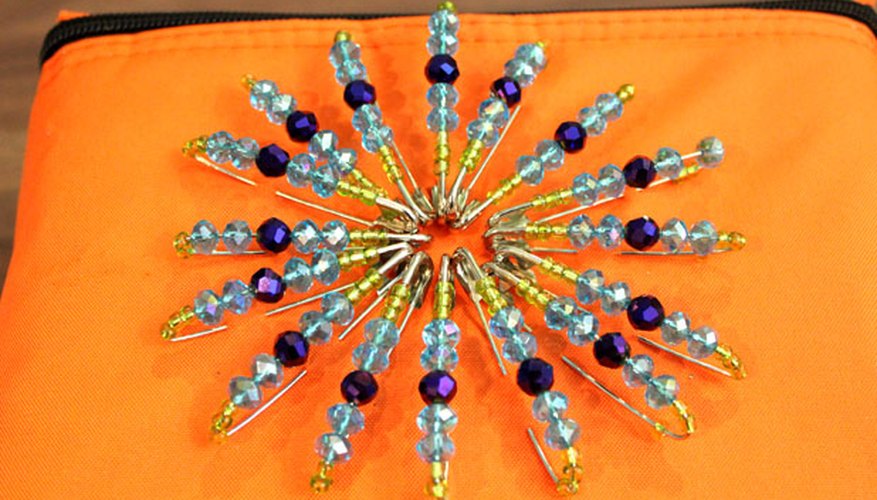 Create a pattern with the safety pins Create a pattern with the safety pins