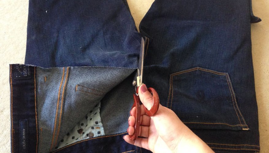 Cut your jeans down the middle. Cut your jeans down the middle.