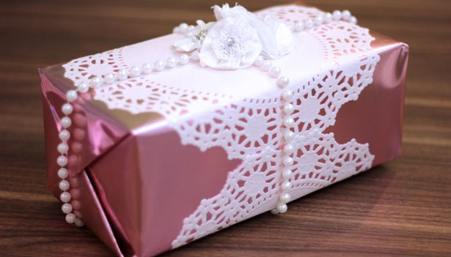 Photo Credit: Jonathan Fong Attach floral embellishments