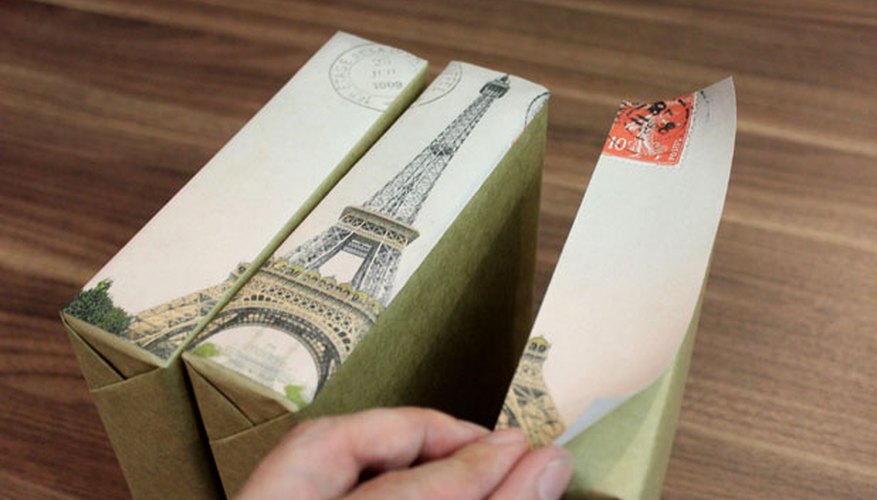 Photo Credit: Jonathan Fong Adhere the cut-up images to the boxes