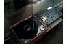 Put the vinyl record on the wood to heat it.