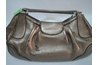 If you do not clean your coat regularly, it could end up with black mildew spots like this purse.