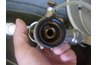 The bottom of coupler connects to the keg.