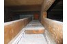 The drywall is attached underneath the floor joists.