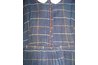 This homespun dress is all hand sewn, with persimmon-seed buttons.