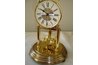 Golden globes ornament the pendulum