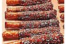 Chocolate Dipped Pretzels Decorated with Christmas Colored Sprinkles