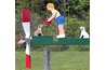 When the wind blows on this whirligig, the boy raises his arms and the dog jumps for the ball