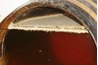 Flor tops sherry in a transparent-ended bota.