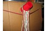 Far ropes are passed between front and back rows and draped over side nails