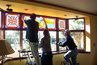 Stained glass installed in a window uses the sun for natural lighting.