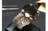 Dark green sometimes is visible in an irradiated black diamond.