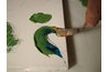 Blending two colors together on a canvas with a palette knife