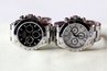 A pair of stainless steel Rolex Daytona watches.