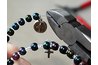 Insert the miraculous medal and cut the wire