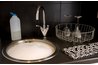 Use dish soap, which is made to remove grease, to wash your copper pieces.