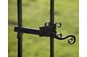 Assuming the gate opens out, tie the rope to the inside of the gate, as the kettlebell will pull the gate shut.