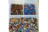 Place the beads on a cookie sheet.