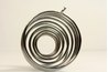 A tapered spiral of wire can be the base for a decorative wind spinner.