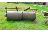 Use a turf roller to press grass seed into the soil.