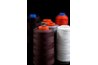 The Janome Serger can use three or four thread spools.