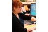 Each morning a reservationist updates her files.