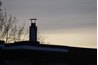 This type of chimney cap will not deflect wind.