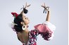 Castanets are bounced against fingers to create varying acoustic pitches.