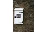 Flush-overlay cabinets can feature visible, externally placed hinges.