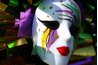 Mardi Gras revelers often wear masks accented with purple, green and gold.
