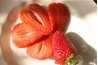 Strawberries can be sliced lengthwise, as shown, or crosswise.