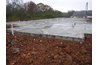 A large concrete slab floor can moderate temperatures in the rest of the building.