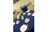 Cub Scouts and adult helpers prepare banquet decorations.