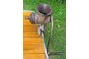 Old fashioned meat grinder mounted on table
