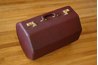 Many hard-sided suitcases are made from polyester resin panels reinforced with fabric or leather.