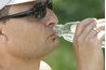 Stay hydrated with at least eight glasses of water each day.