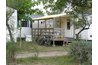 Determining the porch's size and cementing the support posts in place gets you started.
