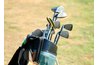 Place a unique bag of golf clubs in a prominent corner.