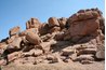Weathering can contribute raw rock materials to soil.
